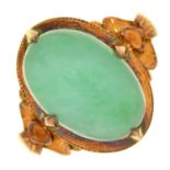 A JADE RING, IN GOLD, MARKED 14K, 6G, SIZE M Good condition, jade with good polish