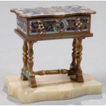 A FRENCH GILT BRASS AND CHAMPLEVE ENAMEL TRINKET BOX IN THE FORM OF A TABLE, A MIRROR TO THE