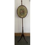 A REGENCY MAHOGANY POLE SCREEN WITH WOOLWORK BANNER, A BRASS FENDER AND A PAINTED WOODEN BUCKET,