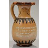 A DOULTON WARE PUZZLE JUG WITH OVOID BODY AND WAISTED NECK, LETTERED IN RELIEF WITH VERSE 'HERE