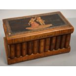 AN ITALIAN OLIVE WOOD AND SORRENTO MARQUETRY JEWEL BOX IN THE FORM OF A ROW OF BOOKS, THE LID