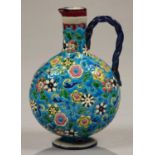 A LONGWY  EARTHENWARE 'CLOISONNE' EWER, DECORATED WITH FLOWERS ON A VIVID TURQUOISE GROUND, 18CM