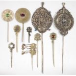 NINE SOUTH AMERICAN SILVER AND OTHER METAL TUPOS OR TOPO, PIN-SPOON, SEVERAL ORNAMENTED WITH