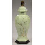 A CELADON COLOURED EARTHENWARE HEXAGONAL TABLE LAMP, DECORATED WITH PRUNUS, 39CM H EXCLUDING