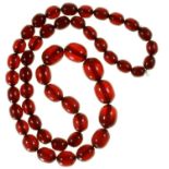 A STRING OF RED AMBER (FATURAN) BEADS Good condition