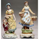 TWO GERMAN PORCELAIN FIGURES OF YOUNG WOMEN, ONE WITH A BOY IN CLARET AND GILT COSTUME, THE OTHER