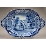 A BLUE PRINTED EARTHENWARE SOUP TUREEN - STAND WITH PRINTS OF FIGURES BETWEEN A CLASSICAL TEMPLE AND