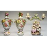 A PAIR OF SITZENDORF FLORAL ENCRUSTED POT POURRI VASES AND COVERS OF PEAR SHAPE AND PRINTED AND