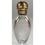 A VICTORIAN JEWELLED SILVER GILT MOUNTED GLASS SCENT BOTTLE, THE THREADED CAP STUDIED WITH CORAL