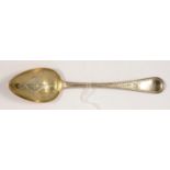 A GEORGE IV SILVER TABLE SPOON, LATER GILT AND ENGRAVED AS A SERVING SPOON, MAKER'S MARK
