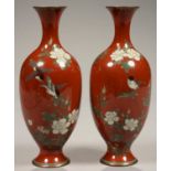 A PAIR OF JAPANESE RED GROUND CLOISONNE ENAMEL OVOID VASES DECORATED WITH FINCHES AND FLOWERS,