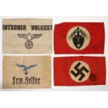 FOUR VARIOUS GERMAN ARMBANDS WITH SWASTIKA OR OTHER SYMBOL Some stains as evident from illustration