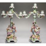 A PAIR OF GERMAN FLORAL ENCRUSTED CANDELABRA OF THREE BRANCHES AND FOUR LIGHTS, DECORATED IN