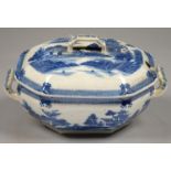 A CHINOISERIE BLUE PRINTED PEARLWARE OCTAGONAL SOUP TUREEN AND COVER WITH A VERSION OF THE BOY ON