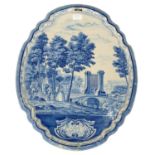 A DUTCH DELFT WARE PLAQUE OF TYPICALLY SHAPED AND MOULDED OVAL FORM, PAINTED WITH GENTLEFOLK AND