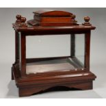 A MAHOGANY TABLE TOP DISPLAY CABINET, WITH STEPPED, DOMED PEDIMENT AND BALL FINIALS, ON BRACKET
