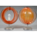 A PAIR OF CHROMIUM PLATED TABLE LAMPS, WITH INTEGRAL COLLAPSIBLE ORANGE PLASTIC GLOBE SHADE, 41CM H,