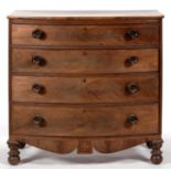 A CHANNEL ISLANDS MAHOGANY AND LINE INLAID BOW FRONTED CHEST OF DRAWERS WITH TURNED KNOBS AND