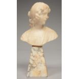 AN ALABASTER BUST OF A YOUNG WOMAN, ON PYRAMIDAL PLINTH, 26CM H, C1920  Minor scratches, corners