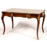 A VICTORIAN SERPENTINE WALNUT AND KINGWOOD WRITING TABLE, IN THE FORM OF A LOUIS XV BUREAU PLAT,