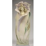 AN ART NOUVEAU ROYAL DUX IRIDESCENT GLAZED PORCELAIN VASE IN THE FORM OF THE HEAD OF A GIRL EMERGING