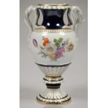 A MEISSEN COBALT AND GILT SERPENT HANDLED VASE, PAINTED WITH A LOOSE BOUQUET AND SUBSIDIARY