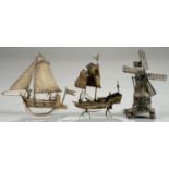 A CONTINENTAL MINIATURE SILVER MODEL OF A WINDMILL, PROBABLY DUTCH, THE BASE SET WITH THREE FIGURES,