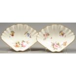 A PAIR OF SAMPSON HANCOCK SHELL SHAPED SWEETMEAT DISHES, PAINTED WITH FLOWER SPRAYS, 17.5CM L, RED