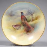 A MINTON BOWL, PAINTED TO THE INTERIOR BY A. HOLLAND, SIGNED, THE EXTERIOR PINK, RIMS GILT, 28.5CM