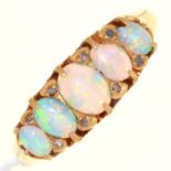 AN EDWARDIAN FIVE STONE OPAL RING WITH DIAMOND ACCENTS, IN 18CT GOLD, CHESTER 1901, 3.7G, SIZE O One
