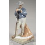 A ROYAL COPENHAGEN FIGURE OF A MAN WITH A SCYTHE, 24.5CM H, PRINTED AND PAINTED MARKS, INCLUDING
