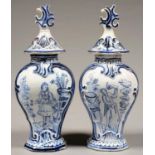 TWO DUTCH DELFTWARE VASES AND COVERS, THE VASES PAINTED WITH A LADY OR GENTLEMAN, 33CM H, 19TH C