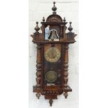 A WALNUT 'VIENNA' CLOCK WITH AUTOMATON, THE BELL STRUCK BY THE PAINTED PLASTER FIGURE OF FATHER