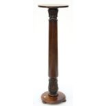 A MAHOGANY PLANT STAND INCORPORATING PART OF A VICTORIAN BED POST, 124CM H, 37CM DIA Good condition