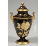 A WEDGWOOD SHIELD SHAPED BONE CHINA BLACK TONQUIN VASE AND COVER, DESIGNED BY JOHN EDWARD GOODWIN