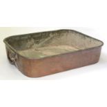 A VICTORIAN OBLONG COPPER ROASTING PAN WITH SUBSTANTIAL HINGED HANDLES, 57CM L Approximately 1"