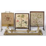 AN EDWARDIAN BRASS FIRESCREEN AND TWO OTHERS, EACH WITH WOOLWORK OR EMBROIDERED BANNER, VARIOUS
