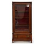 A VICTORIAN MAHOGANY CABINET WITH GLAZED DOOR BETWEEN REEDED PILASTERS, DRAWER BELOW, HAVING BOARDED