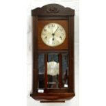 A GERMAN MAHOGANY STAINED WALL CLOCK WITH SILVERED DIAL, ROD GONGS AND BEVELLED GLASS LIGHTS TO