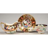 A SPODE JAPAN PATTERN BONE CHINA CREAM JUG AND A TEACUP AND SAUCER EN SUITE, LONDON SHAPE, JUG 9CM