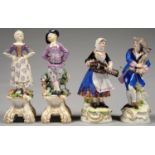 A PAIR OF GERMAN PORCELAIN FIGURES OF ITINERANT MUSICIANS PLAYING THE HURDY-GURDY OR BAGPIPES, ON