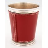 A FRENCH SILVERED METAL BEAKER DESIGNED BY DOMINIC CHAMBON WITH STITCHED RED LEATHER SLEEVE, 10.