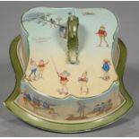 A STAFFORDSHIRE EARTHENWARE SHIELD SHAPED CHEESE DISH AND COVER, DECORATED WITH BROWNIES (
