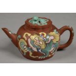 A CHINESE YIXING STONEWARE TEAPOT AND COVER, ENAMELLED IN PRINCIPALLY TURQUOISE, YELLOW AND BLUE