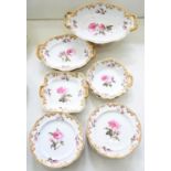AN ENGLISH PORCELAIN DESSERT SERVICE, MOULDED WITH FESTOONS AND FINELY PAINTED WITH CENTRAL ROSE,