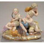 A MEISSEN GROUP OF SUMMER FROM A SET OF THE FOUR SEASONS, THE FOUR INFANTS WITH SHEAVES OF CORN, ONE