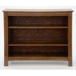 AN OAK OPEN BOOKCASE WITH ADJUSTABLE SHELVES BETWEEN FLUTED UPRIGHTS, 91CM H; 29.5 X 109CM Good