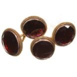 A PAIR OF VICTORIAN FOILED GARNET AND GOLD CUFFLINKS, OF OVAL SHAPE WITH FACETED EDGE, 10 X 11MM,