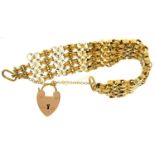 A GOLD BRACELET AND GOLD PADLOCK, MARKED 9C, 38.9G Small repair to one end link of bracelet