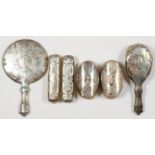 AN ART NOUVEAU SIX PIECE SILVER BRUSH SET, HAMMER TEXTURED, CRESTED, BY SAUNDERS AND SHEPHERD,